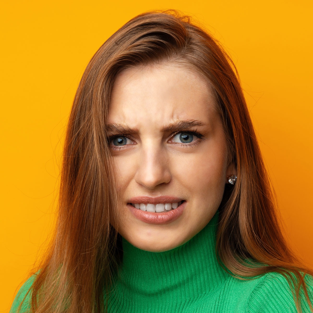 stressed-emotional-angry-woman-on-yellow-studio-ba-2022-10-03-20-21-25-utc.jpg